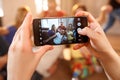 Close up of girlÃ¢â¬â¢s hands making photo with cell phone Royalty Free Stock Photo